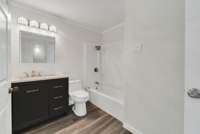 full bathroom with washtub / shower combination, crown molding, wood-type flooring, toilet, and vanity