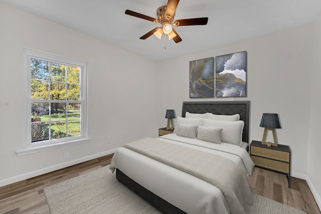 bedroom featuring hardwood / wood-style flooring and ceiling fan