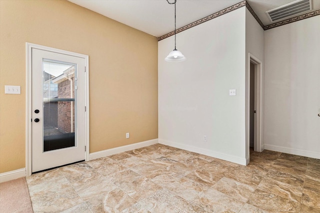 unfurnished room with visible vents and baseboards