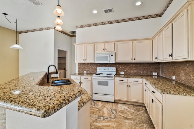 kitchen featuring decorative light fixtures, visible vents, backsplash, a sink, and white appliances