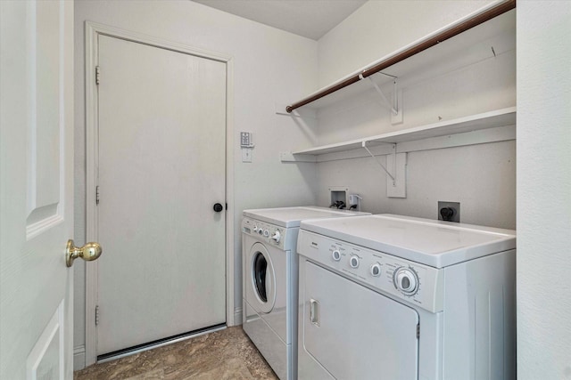 laundry room with laundry area and washer and clothes dryer