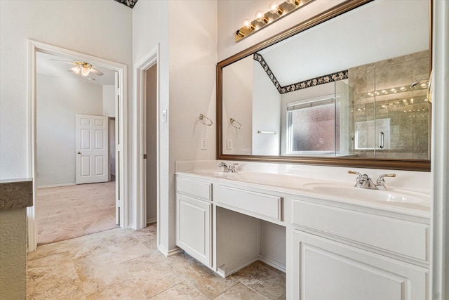 full bathroom with ceiling fan, a stall shower, a sink, and double vanity