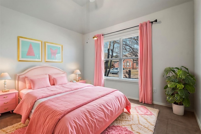 bedroom featuring carpet floors and baseboards