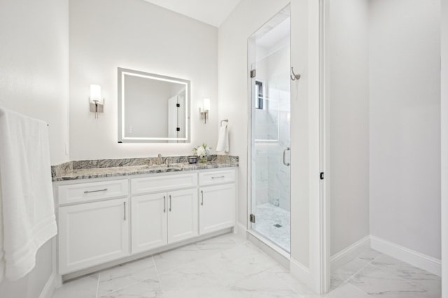 bathroom with vanity and walk in shower