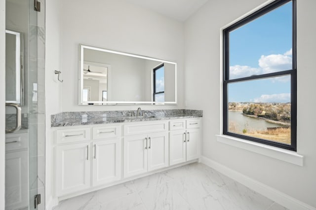 bathroom featuring a water view, vanity, and an enclosed shower