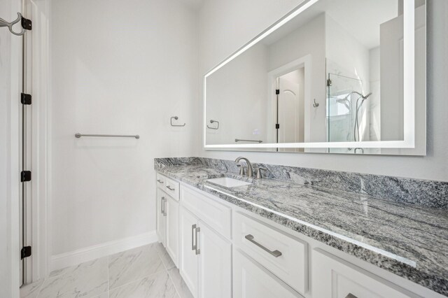 bathroom featuring vanity and an enclosed shower