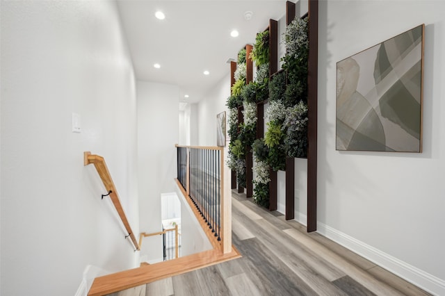 corridor with light hardwood / wood-style floors