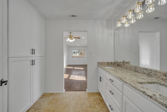 bathroom featuring vanity and ceiling fan