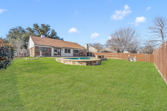 view of yard featuring a fenced in pool