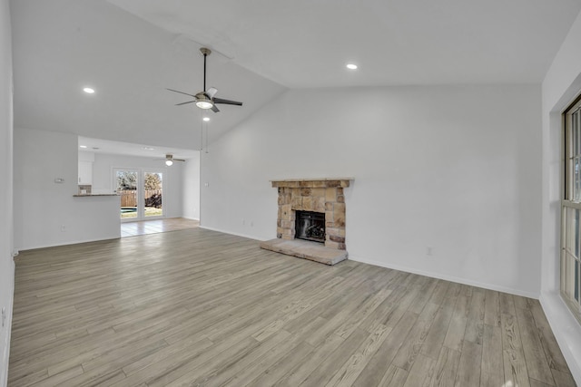 5400 Gregory Dr, Flower Mound, TX 75028 - unfurnished living room featuring a ceiling fan, a fireplace, lofted ceiling, light wood-style flooring, and recessed lighting