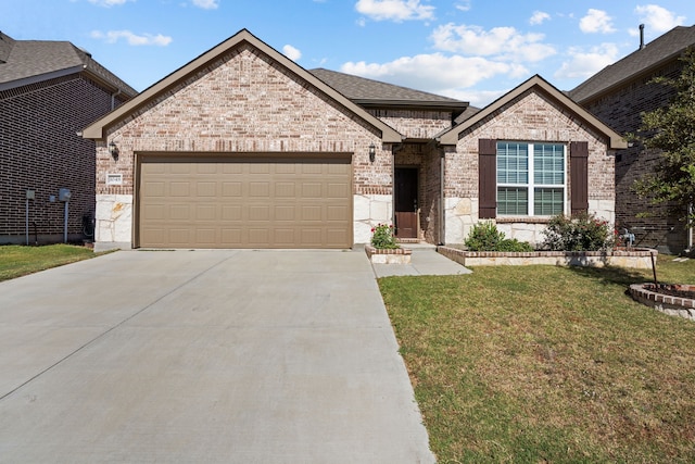 view of front of property with a front lawn and a garage