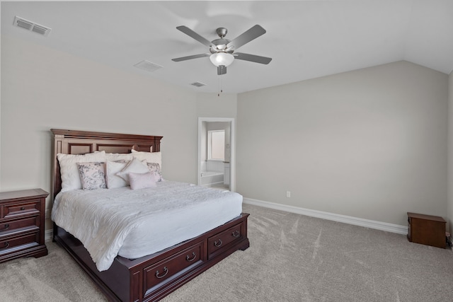 bedroom with light colored carpet, ceiling fan, lofted ceiling, and ensuite bathroom