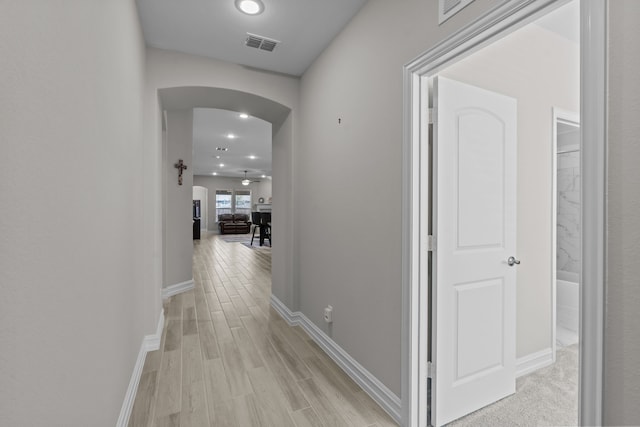 hallway with light wood-type flooring