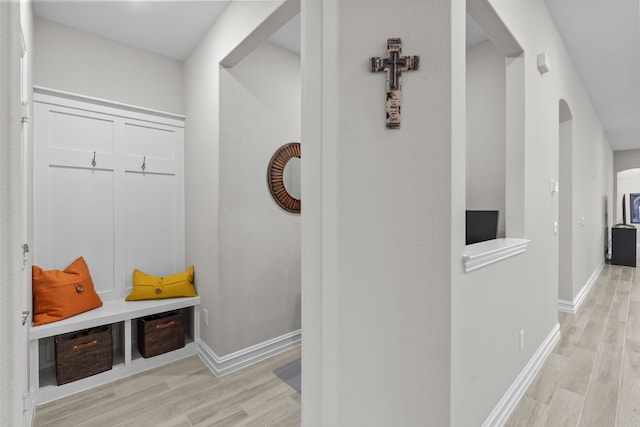 mudroom with light hardwood / wood-style floors