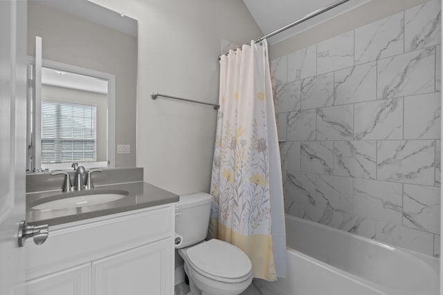 full bathroom featuring vanity, shower / tub combo, and toilet