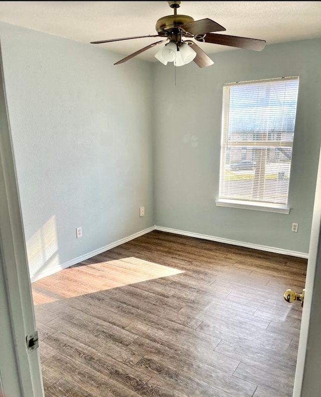 unfurnished room featuring ceiling fan and hardwood / wood-style floors