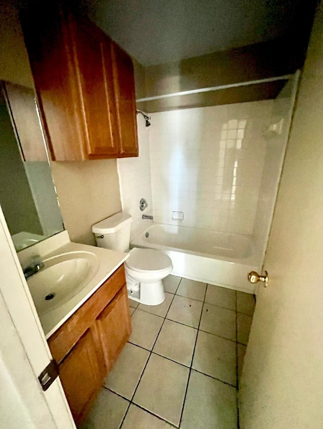 full bathroom with tile patterned flooring, vanity, toilet, and tiled shower / bath