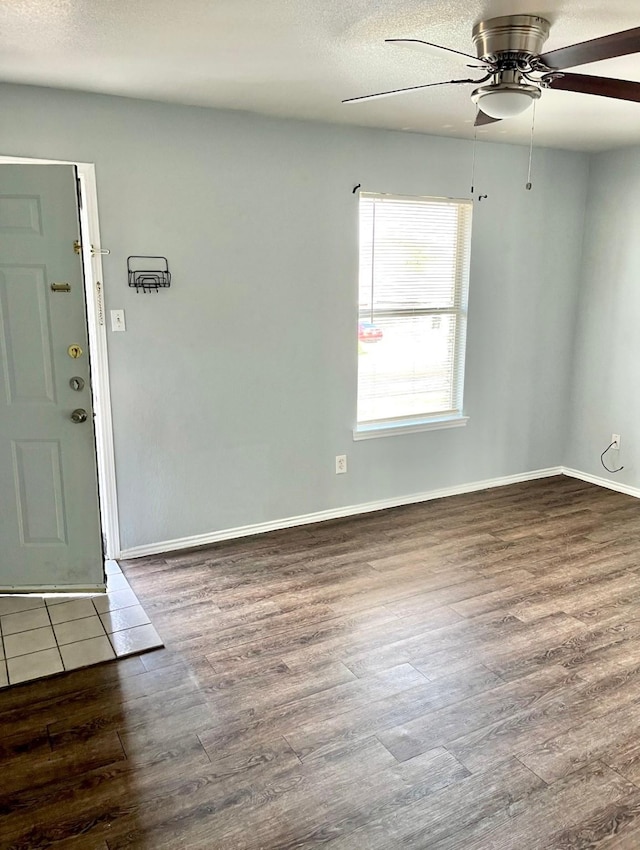 unfurnished room featuring ceiling fan, a textured ceiling, and hardwood / wood-style flooring