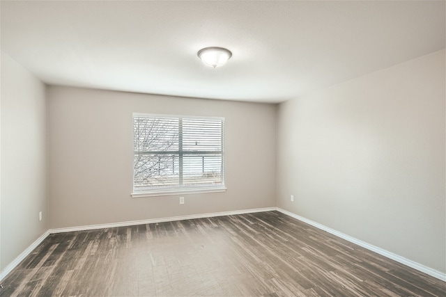 unfurnished room featuring dark hardwood / wood-style floors