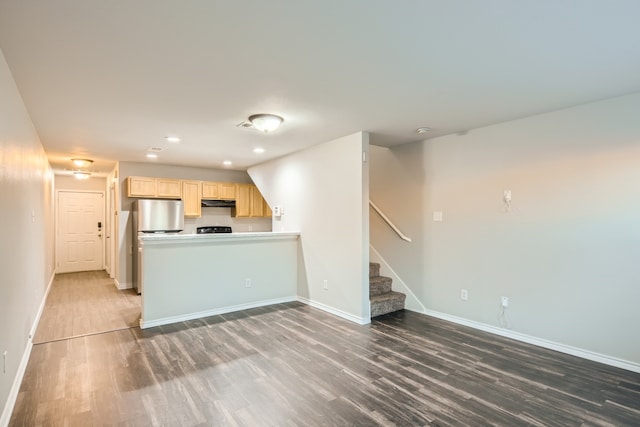 unfurnished living room with dark hardwood / wood-style floors