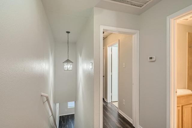 hallway with dark hardwood / wood-style floors