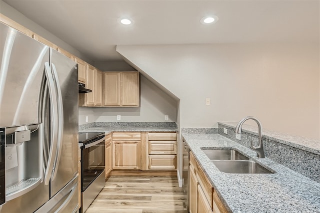 kitchen featuring sink, light hardwood / wood-style flooring, appliances with stainless steel finishes, light stone countertops, and light brown cabinetry