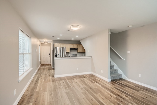 unfurnished living room with light hardwood / wood-style floors