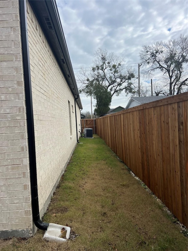 view of yard with central AC