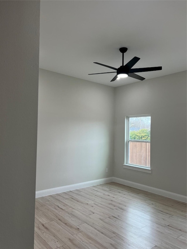 spare room featuring light wood-type flooring and ceiling fan