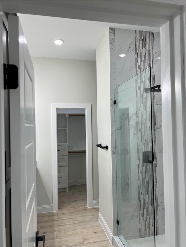 bathroom with a shower with shower door