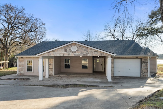 view of front of house with a garage and a carport