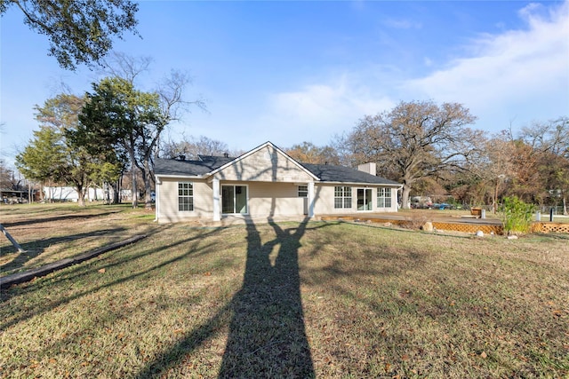 ranch-style home with a front yard