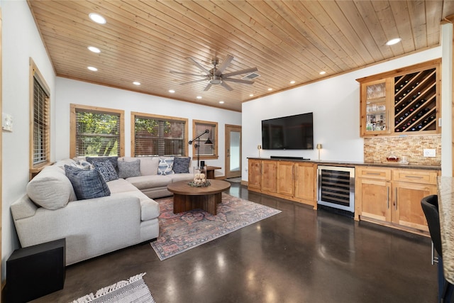 living room with bar area, ceiling fan, beverage cooler, and wooden ceiling