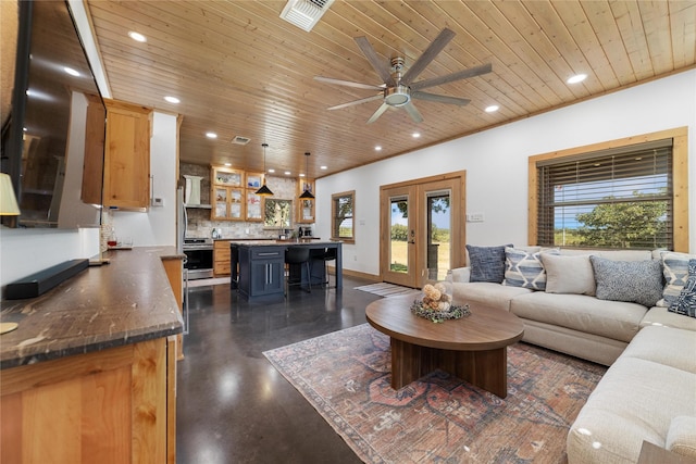 living room with french doors, ceiling fan, and wood ceiling