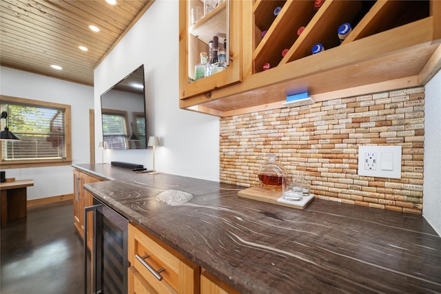 kitchen featuring brick wall, wood ceiling, and beverage cooler