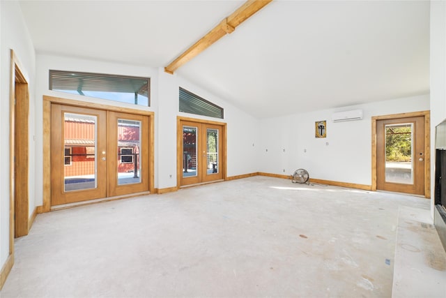 unfurnished living room with lofted ceiling with beams, a wall unit AC, and french doors