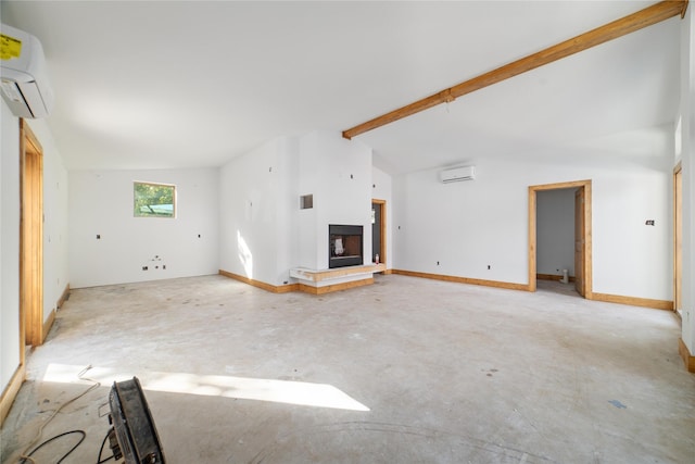 unfurnished living room featuring a wall mounted air conditioner and vaulted ceiling with beams