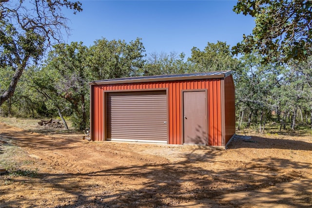 view of outbuilding featuring a garage