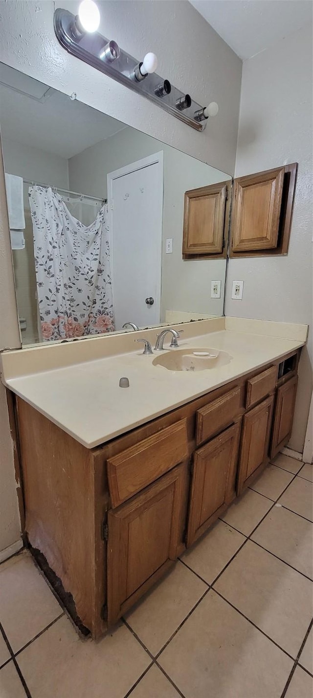 bathroom with tile patterned floors and vanity