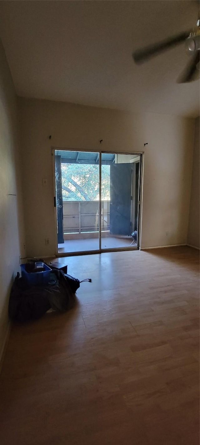 empty room with light wood-type flooring and ceiling fan