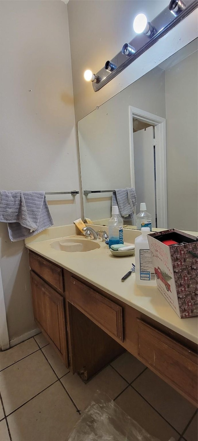 bathroom featuring tile patterned flooring and vanity