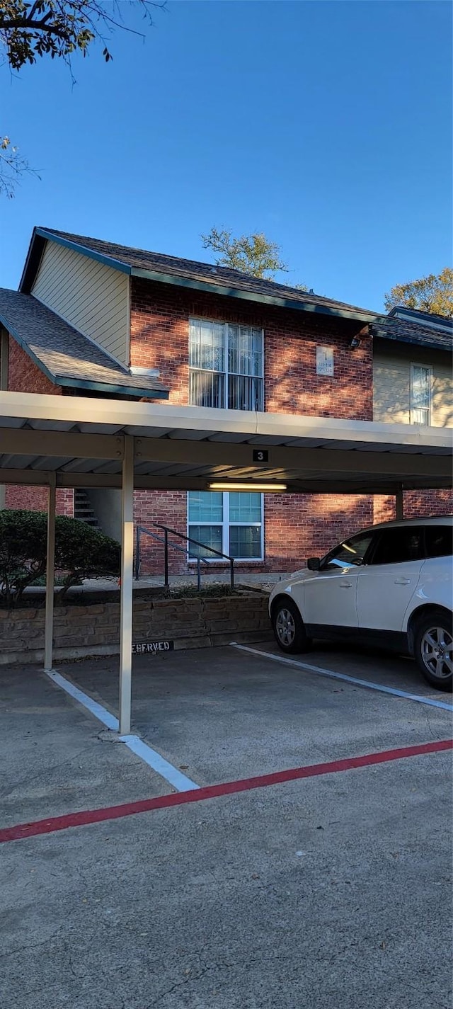 view of car parking featuring a carport