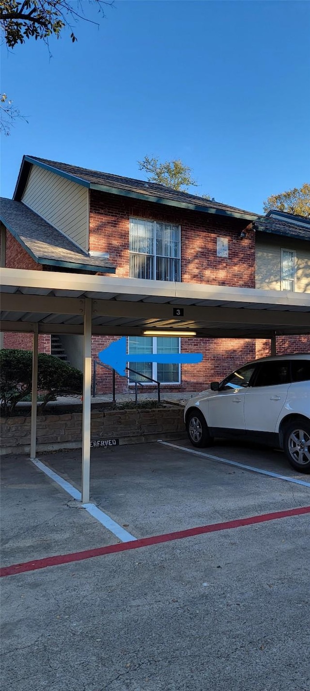 view of parking with a carport