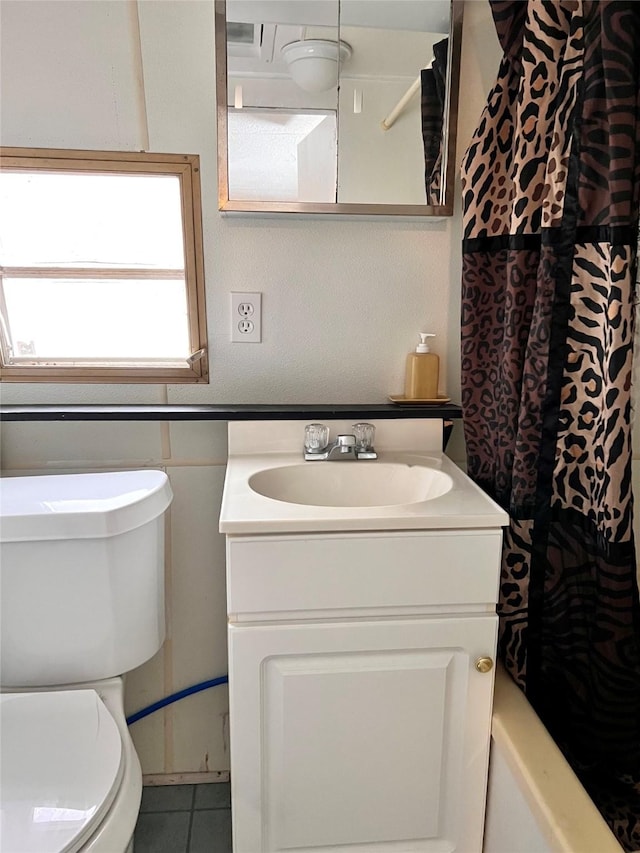 bathroom featuring toilet and vanity