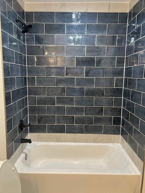 full bathroom with shower / washtub combination