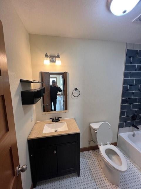 full bathroom featuring bathing tub / shower combination, vanity, and toilet