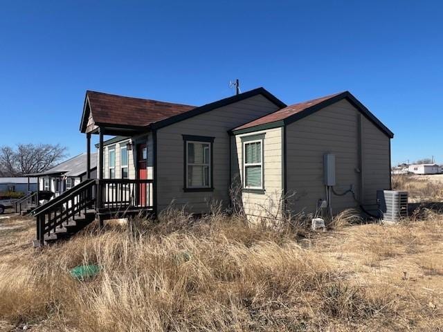 view of side of home with cooling unit