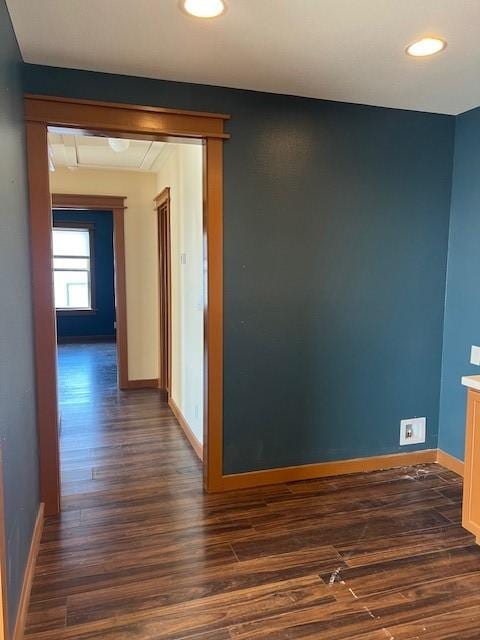 hall with recessed lighting, dark wood finished floors, and baseboards