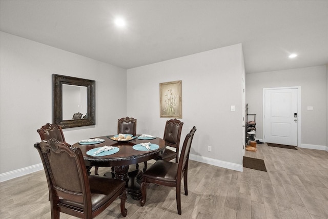 dining area featuring light wood-type flooring