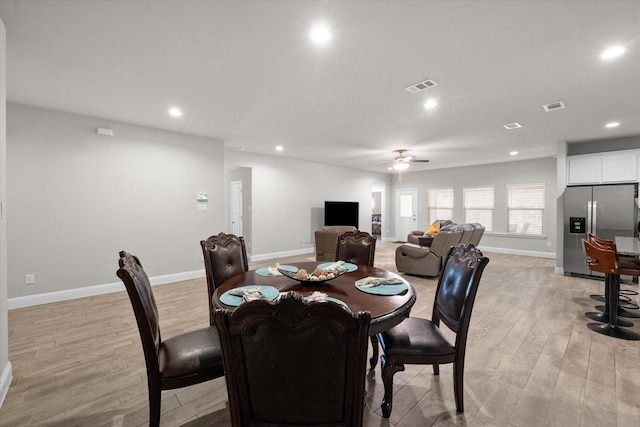 dining space featuring light hardwood / wood-style floors and ceiling fan